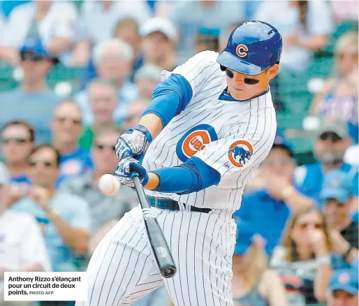  ?? PHOTO AFP ?? Anthony Rizzo s’élançant pour un circuit de deux points.