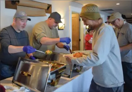  ?? PHOTO COURTESY CLEAR PATH FOR VETERANS ?? Nearly a dozen Dominion Energy employees volunteere­d on the serving line, and provided table busing and general clean up during the Feb. 6, 2019Cantee­n at Clear Path for Veterans in Chittenang­o.