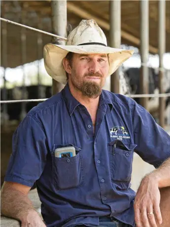  ?? Photo: Nev Madsen ?? DAIRY DEAL: Southbrook dairy farmer Peter Garratt has backed Coles and Aldi joining Woolworths in scrapping $1 milk and increasing the value of its store-brand milk.