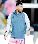  ?? — AFP file photo ?? Messi warms up before a friendly match,