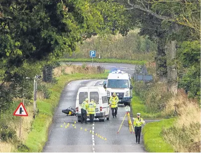  ?? Picture: Steve MacDougall. ?? Police at the scene of the fatal accident involving a minibus and a motorcycle on the A923 near the turn-off to Fowlis.