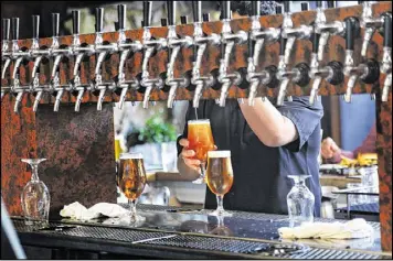  ?? GINA FERAZZI PHOTOS / LOS ANGELES TIMES ?? Stone Brewery, of Escondido, Calif., opened a brewery in Berlin in June, becoming the first American craft brewery to operate in Germany.