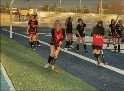  ?? JUSTIN COUCHOT — ENTERPRISE-RECORD ?? Chico High field hockey player Danielle Dowell (5), a junior, warms up before the Panthers’ match with Pleasant Valley on Wednesday. She’s among the players whose families have first-hand experience with cancer.