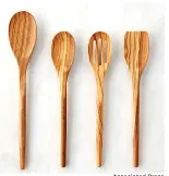  ?? Associated Press ?? Williams Sonoma offers olive wood utensils.