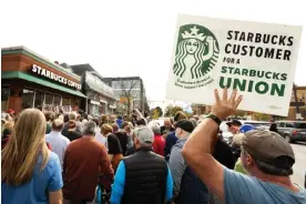  ?? Photograph: Lindsay Dedario/Reuters ?? Union supporters gather outside a Starbucks location in Buffalo, New York, on 12 October 2022.