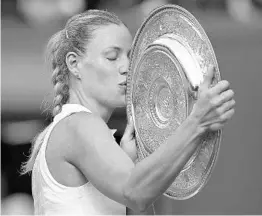  ?? ANDREW COULDRIDGE/AFP/GETTY IMAGES ?? After beating Serena Williams to win her first Wimbledon title on Saturday, Angelique Kerber told Williams: “You’re such an inspiratio­n for everybody, for all of us.”