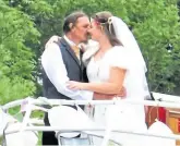  ?? ?? A kiss for the bride: Joe and Gillian on board Peter Le Marchant Trust boat Serenade.