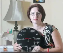  ?? Ted Rhodes/calgary Herald ?? Cristina Popescu uses this clock as a high school math teacher.