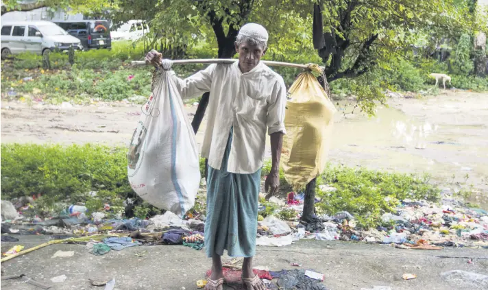  ??  ?? Petehan Abul Hasan says they placed everything they might need during their journey to Bangladesh in two sacks he carried for days, from a pot and rice, to his wife’s favorite handbag.