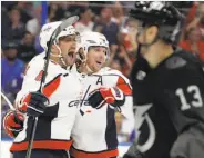  ?? Chris O’Meara / Associated Press ?? The Capitals’ Alex Ovechkin (8) celebrates his 50th goal before going on to get No. 51 on a power play.