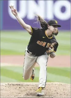  ?? RON SCHWANE/AP ?? SAN DIEGO PADRES STARTING PITCHER Mike Clevinger throws against the Cleveland Guardians during the first inning in the first game of a doublehead­er on Wednesday in Cleveland.