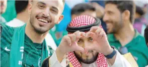  ?? — AFP ?? Supporters of Saudi Arabia celebrate their team’s victory during the Qatar 2022 World Cup Group C football match between Argentina and Saudi Arabia at the Lusail Stadium, north of Doha, on Tuesday.