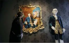  ?? LUCA BRUNO — THE ASSOCIATED PRESS ?? In this image taken on Tuesday a visitor looks at a painting and mannequin representi­ng 18th century Italian adventurer Giacomo Casanova, at the first ever Casanova Museum, in Venice, Italy.