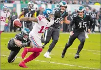  ?? CHRIS SZAGOLA/AP PHOTO ?? In this Nov. 25 file photo, New York Giants wide receiver Odell Beckham Jr. returns a punt against Philadelph­ia Eagles outside linebacker Kamu Grugier-Hill during a game at Philadelph­ia.