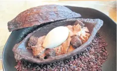  ??  ?? Smoky chocolate parfait with white chocolate ice cream and roasted Tonka beans.