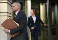  ?? SUSAN WALSH — THE ASSOCIATED PRESS ?? Rick Gates, right, leaves federal court in Washington, Monday. Paul Manafort, President Donald Trump’s former campaign chairman, and Manafort’s business associate Gates pleaded not guilty to felony charges of conspiracy against the United States and...