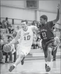  ?? Submitted photo ?? FINISH STRONG: National Park College freshman Westin Church (10) dribbles to the basket against Arkansas Baptist College sophomore Cedric Daniels Monday in the Nighthawks’ final regular season game of the year at the NPC Wellness Center. The Nighthawks...