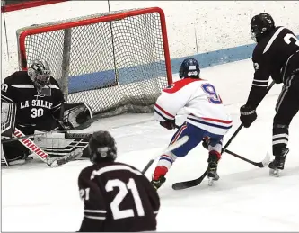  ?? Photos by Ernest A. Brown ?? Mount St. Charles sophomore forward Kyle Smolan (9) scored the No. 1 Mounties’ first goal in the second period of Friday night’s 3-2 overtime win over La Salle in Game 1 of their state semifinal series.