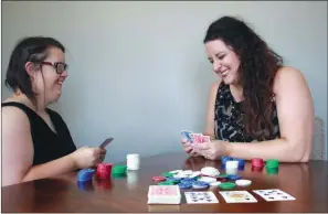  ?? SAM PIERCE/TRILAKES EDITION ?? Lyndsey Smith, left, and Bekka Wilkerson, special events coordinato­r for Civitan Services, play a round of poker in preparatio­n for the first ever Bet With Heart Casino Night on July 26 at 111 N. Main St. in downtown Benton.