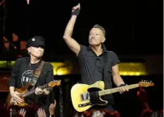 ?? Chris O'Meara/Associated Press ?? Singer Bruce Springstee­n, right, and E Street Band member Nils Lofgren perform Feb. 1, 2023, at Amalie Arena in Tampa, Fla.