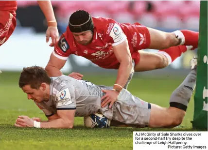  ??  ?? AJ Mcginty of Sale Sharks dives over for a second-half try despite the challenge of Leigh Halfpenny.
Picture: Getty Images