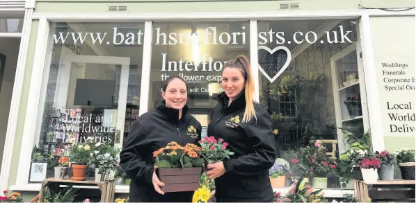  ??  ?? Cassie Wootton and Anna Marsh outside the Bath Spa Florists, which is flourishin­g after its move to Widcombe Parade 11 years ago