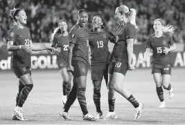  ?? JESSICA ALCHEH USA TODAY NETWORK ?? U.S. women’s team midfielder Jaedyn Shaw, center, celebrates with teammates after scoring a goal against Argentina during the first half at Dignity Health Sports Park on Friday night.