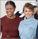  ??  ?? Olive branch: Michelle Obama welcomes Melania Trump at the White House