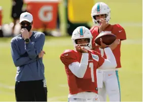  ?? MICHAEL REAVES / GETTY ?? Quarterbac­k Tua Tagovailoa is the crown jewel among the Dolphins’ new additions.