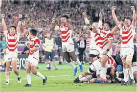  ?? AFP ?? Japan players reacts after beating Scotland at the Rugby World Cup.