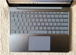  ??  ?? A large, slick trackpad dominates the Surface Laptop Go’s keyboard.