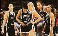  ?? Christian Petersen / Getty Images ?? From left, Diana Taurasi, Brianna Turner, Sophie Cunningham, Brittney Griner and Skylar Diggins-Smith of the Phoenix Mercury stand on the court during the second half in Game 2 of the 2021 WNBA Finals against the Chicago Sky in October.