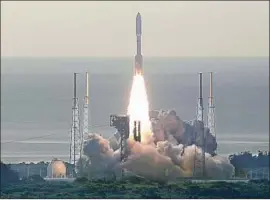  ?? John Raoux Associated Press ?? PERSEVERAN­CE rides a mighty Atlas V rocket at Cape Canaveral, Fla., into the morning sky in the world’s third and final Mars launch of the summer.