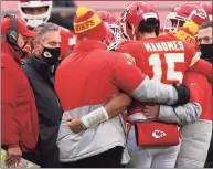  ?? Jamie Squire / TNS ?? Chiefs quarterbac­k Patrick Mahomes is assisted off the field after an injury from a sack that would remove him in the third quarter of the AFC divisional-round game against the Browns on Jan. 17.