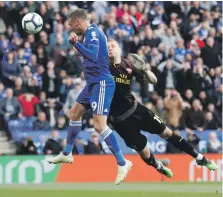  ?? Reuters ?? Jamie Vardy heads home Leicester City’s second goal against Arsenal at the King Power Stadium yesterday