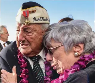  ?? STEPHANIE KEITH, GETTY IMAGES ?? Armando (Chick) Galella gets emotional after a wreath-laying ceremony aboard the Intrepid Sea, Air and Space Museum the on Thursday in New York City. Japanese forces attacked Pearl Harbour 76 years ago.