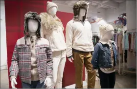  ?? AP PHOTO/MARY ALTAFFER ?? In this Oct. 23 photo, clothing is displayed during a Target Holiday Outlook event in New York.