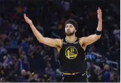  ?? JEFF CHIU — THE ASSOCIATED PRESS ?? Golden State Warriors guard Klay Thompson celebrates after a 3-pointer against the Memphis Grizzlies during the second half of Game 3of a Western Conference playoff semifinal in San Francisco on Saturday.