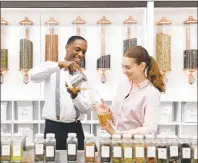  ?? CP PHOTO ?? Daniel Lewis and his wife Renata, owners of tea shop T By Daniel, are celebratin­g the upcoming nuptials of Prince Harry and Meghan Markle with their tea, When Harry Met Meghan, at the Bramalea City Centre Mall last month in Brampton.