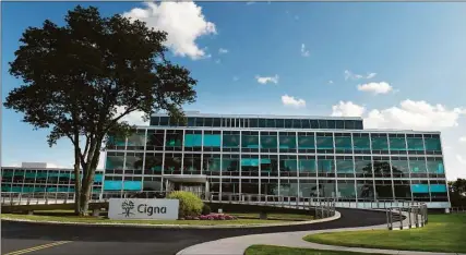  ?? Michael McAndrews / Associated Press ?? Cigna, the No. 13 company on the 2021 Fortune 500 list, is headquarte­red at 900 Cottage Grove Road in Bloomfield.