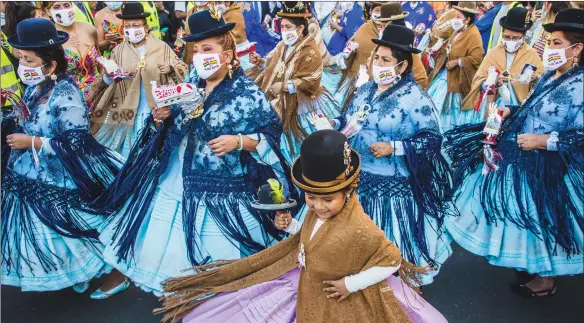  ?? ?? A girl dances on Hispanic Day, Spain’s National Day, in Madrid, which marks the arrival of Christophe­r Columbus on his first voyage to the island of San Salvador in October 1492