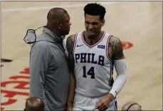  ?? JOHN BAZEMORE - THE ASSOCIATED PRESS ?? Danny Green, right, walks past 76ers coach Doc Rivers after Green left Friday’s game with a right calf strain that will keep the guard out of the lineup for at least two weeks.