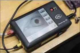 ??  ?? A monitor that records the size of an eye’s pupil to adjust the amount of light in a room at the University of Southern California in Los Angeles..