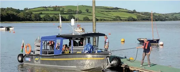  ??  ?? The Glanferry ferry boat which links Llansteffa­n and Ferryside across the River Towy will not run again this year.