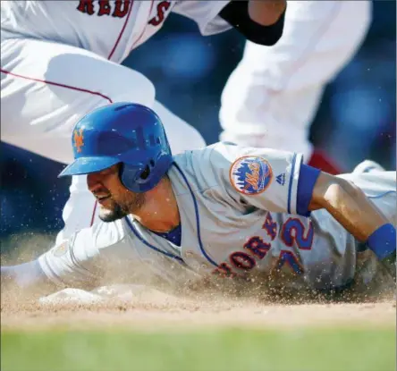  ?? MICHAEL DWYER — THE ASSOCIATED PRESS ?? New York Mets’ Jack Reinheimer is picked off at first base after attempting to steal second during the eighth inning of a baseball game against the Boston Red Sox in Boston, Sunday.