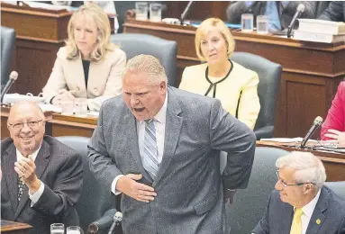  ?? CHRIS YOUNG/THE CANADIAN PRESS ?? Ontario Premier Doug Ford takes a bow after bragging about his election victory during Question Period at the Ontario Legislatur­e in Toronto on Monday.