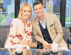  ?? AP PHOTO ?? In this May 1 file photo, released by Disney/ABC Home Entertainm­ent and TV Distributi­on, Kelly Ripa and Ryan Seacrest pose for a photo at “Live” in New York. On Monday, “Live with Kelly and Ryan” launches a new season, its 30th in national syndicatio­n.