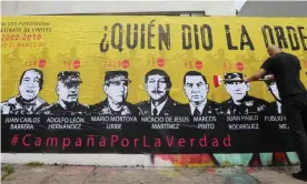  ??  ?? A billboard in Bogota about Colombia’s false positives scandal, asking ‘Who gave the order?’ Photograph: EFE News Agency/Alamy