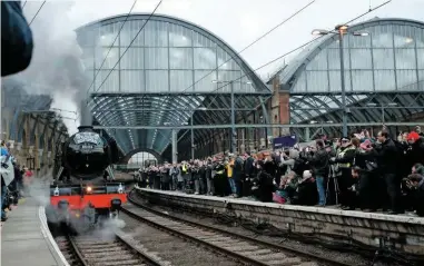  ?? PA PHOTOS. ?? Prior to its inaugural run on February 25 2016, 60103 Flying Scotsman draws the crowds at a packed London King’s Cross. Jim Reside says such an iconic brand culd be harnessed for the benefit of the rail industry.