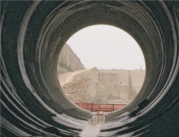  ?? | NEIL STEINBERG/ SUN- TIMES PHOTOS ?? Stage one of the new McCook Reservoir as seen from within the 33- foot- diameter pipe that will carry stormwater to the site.